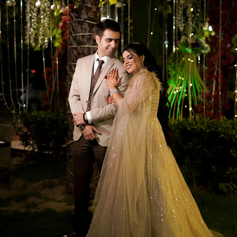 Bride and groom sharing first dance at sunset on a waterfront terrace