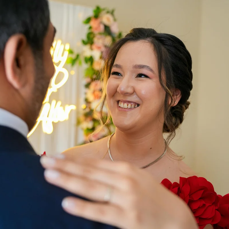 Intimate dinner setup with linen tablecloths and blush floral arrangements